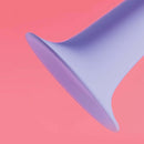 Close-up of the base of the Biird Surii 6 inch Silicone Dildo with Suction Cup on a pink background.