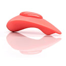 Clandestine Mimic Companion Coral Wearable Panty Vibrator on a reflective surface.