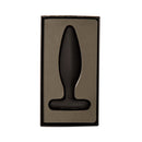 Je Joue Egon Vibrating Butt Plug Black in its packaging, showcasing its sleek design and luxurious finish.