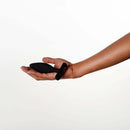 Je Joue Vesta Vibrating Butt Plug Black held in a hand, showcasing its ergonomic design and sleek silhouette.