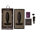 Je Joue Vesta Vibrating Butt Plug Black in elegant packaging with USB charger and user manual.