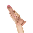 Shaft Model A 10.5 inch Dual Density Dildo with Balls Pine held in hand showcasing realistic design and textures.