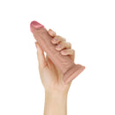 Shaft Model J 5.5 Inch Dual Density Silicone Dildo Pine held in hand, showcasing its realistic design and texture.