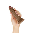 Shaft Model J 5.5 Inch Dual Density Silicone Dildo Oak being held in a hand, showcasing its realistic design.