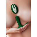 FemmeFunn Ossia Wearable Bullet Vibrator Dark Green displayed in hand showcasing its ergonomic design and remote control.