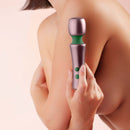 FemmeFunn Bougie Wand Rose Gold held against a woman's shoulder for luxury pleasure and sophistication.