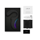 LELO Enigma Wave Suction Dual Stimulator Black in its packaging with accessories including USB and warranty card.