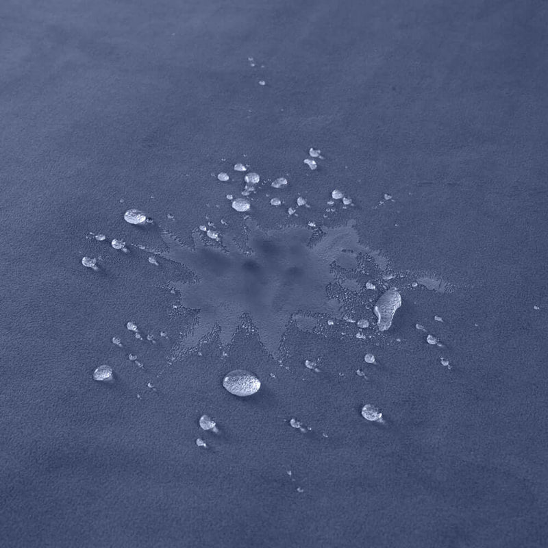 Close-up of water droplets on the Liberator Fascinator Mini Waterproof Throw Blanket Blue.