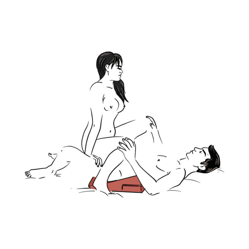 Couple using the Liberator Wedge Sex Pillow Red for enhanced intimacy and pleasure.