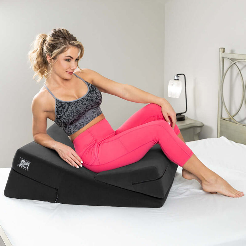 Liberator Wedge and Ramp Sex Positioning Pillow Combo Black shown with a model for enhancing bedroom intimacy.
