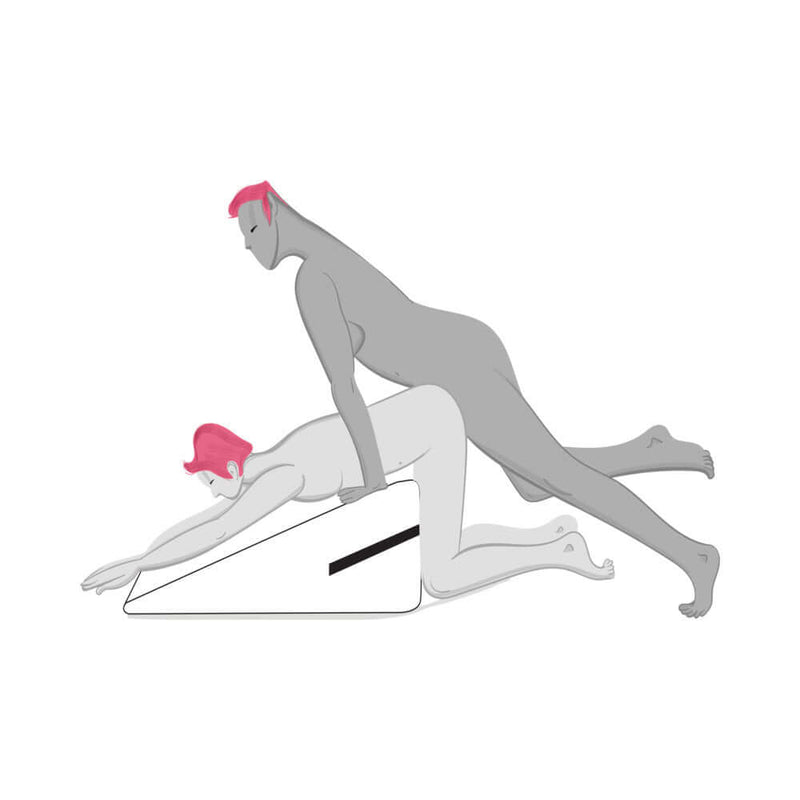 Couple using the Liberator Ramp Sex Positioning Pillow Original Red for enhanced pleasure and comfort.