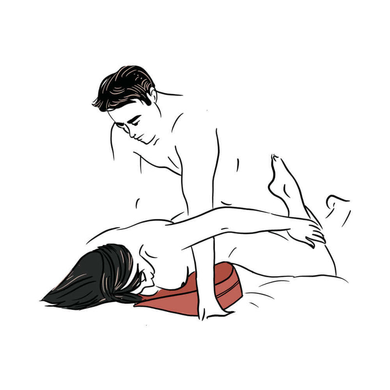 Couple demonstrating use of Liberator Heart Wedge Sex Pillow Blue for enhanced positioning and comfort.