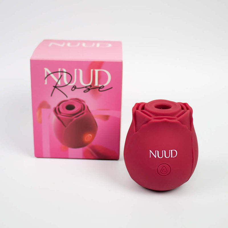 NUUD ROSE Pulsing Vibrator displayed with its elegant packaging, featuring a delicate rose design and vibrant color.
