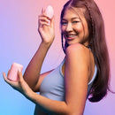 Model showcasing the VUSH Plump Palm Squishy Vibrator and egg-shaped massager in vibrant lighting.