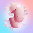 VUSH Plump Palm Squishy Vibrator in a pink, egg-shaped design with bubbles in a colorful background.