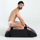 Liberator Scoop Rocker Valkyrie Edition with Cuffs Plum showcasing a man seated with cuffs in a dynamic position.