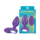 Luv Inc Pr17 Vibrating Butt Plug With Remote Purple with glowing remote and packaging on display.
