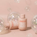 Playground Date Night Water-based Personal Lubricant bottle surrounded by bubbles on a pastel background.