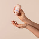 Playground Love Sesh Water-based Personal Lubricant in hand dispensing smooth, slippery texture.