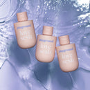 Playground Love Sesh Water-based Personal Lubricant bottles floating in water, showcasing their sleek design.