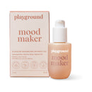 Playground Mood Maker Intimacy Oil with a silky smooth texture in a bottle next to its packaging.