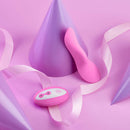 FemmeFunn Unda Panty Vibrator Pink surrounded by decorative cones and ribbon on a pink background.