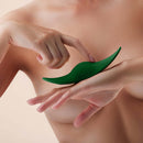 FemmeFunn Unda Panty Vibe Dark Green held by hands, showcasing its ergonomic design and texture.