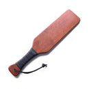 Stockroom Essentials Leather Wrapped Spanking Paddle with smooth wooden surface and leather grip.