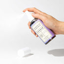 Eye of Love Bloom Attract Him Pheromone Room Spray Lilac Dream 5 Oz held in hand with spray nozzle.