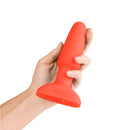 b-Vibe Rimming 2 Rotating and Vibrating Remote Control Plug Orange held in hand, showcasing its innovative design.