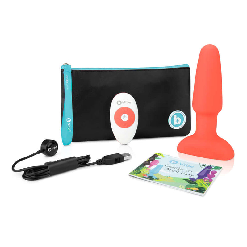 b-Vibe Rimming 2 Rotating and Vibrating Remote Control Plug Orange with remote, charging cable, and guide.