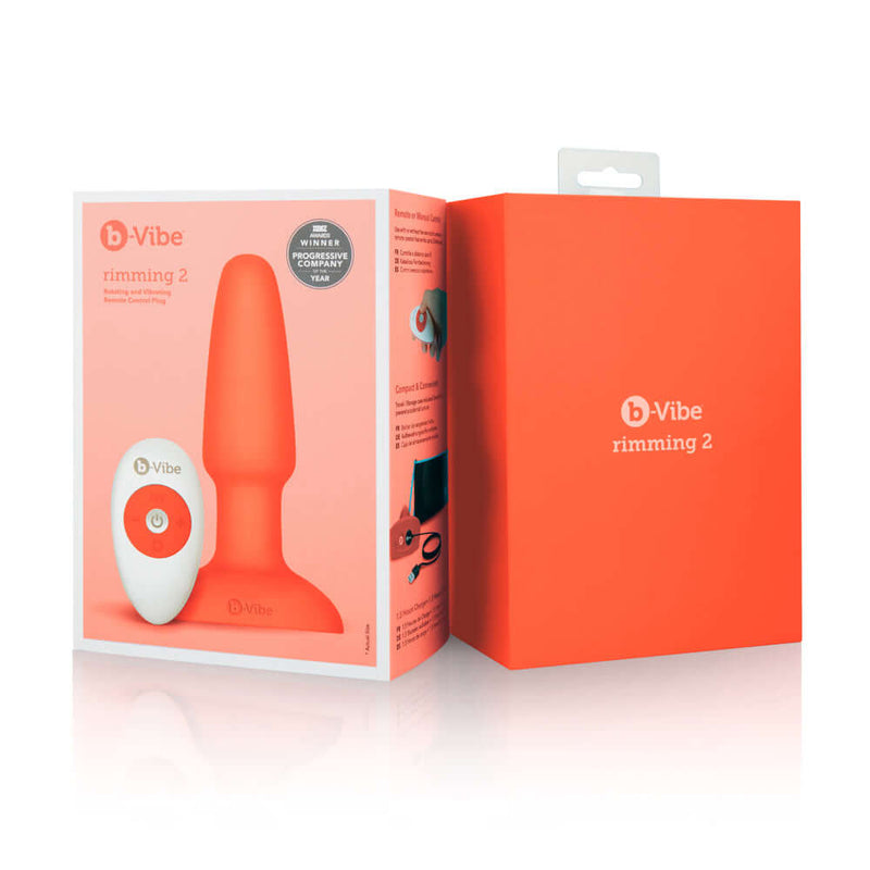 b-Vibe Rimming 2 Rotating and Vibrating Remote Control Plug Orange packaging with remote and butt plug.