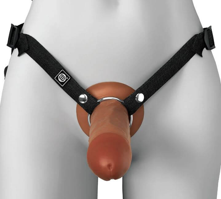 Brown silicone hollow strap-on with black adjustable harness, dual density design for comfort and functionality.