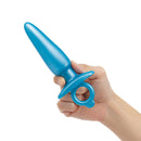 b-Vibe Butties Sleek Tapered Silicone Plug held in a hand, showcasing its smooth, tapered design and body-safe silicone.