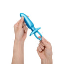 b-Vibe Butties Hither Silicone Prostate Plug held in hands, showcasing its ergonomic design and vibrant blue color.