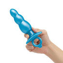b-Vibe Butties Bounce Beaded Silicone Plug held in hand, showcasing its textured design and flexible silicone.