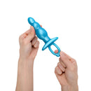 b-Vibe Butties Bounce Beaded Silicone Plug held in hands showcasing its design and texture.