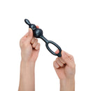 Person holding the b-Vibe Beaded Butties Bundle 3-Piece Anal Plug Set, showcasing its ergonomic design.