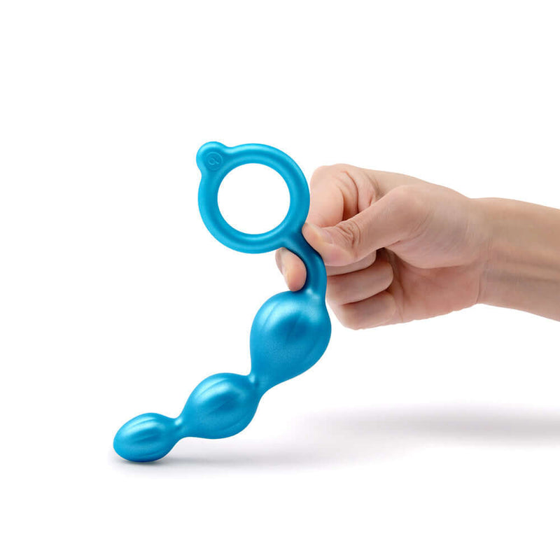 b-Vibe Beaded Butties Bundle 3-Piece Anal Plug Set shown in blue hand-held position for pleasure exploration.