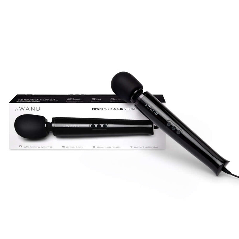 Le Wand Plug-In Vibrating Massager Black displayed with packaging.