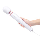 Le Wand Plug-In Vibrating Massager White being held, showcasing its sleek design and control buttons.