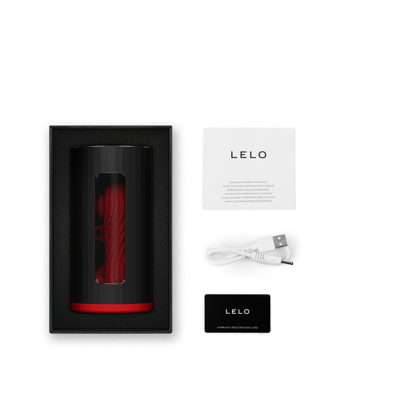 LELO F1S V3 Red App Controlled Masturbator in packaging with accessories including USB charging cable.