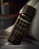 Wicked Sensual Massage Oil Honeysuckle & Ivy 4 Oz bottle on a soft surface with a seductive scent.