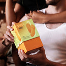 VUSH Luna Wearable Vibrator packaging held by person, showcasing the product design and branding.