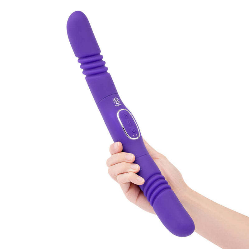 Together Couples Double Delight Purple dual-ended vibrator held in hand with a sleek and flexible design.