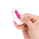 Hand holding the Together Couples Suck N Go Pink stimulator featuring a sleek design and control button.
