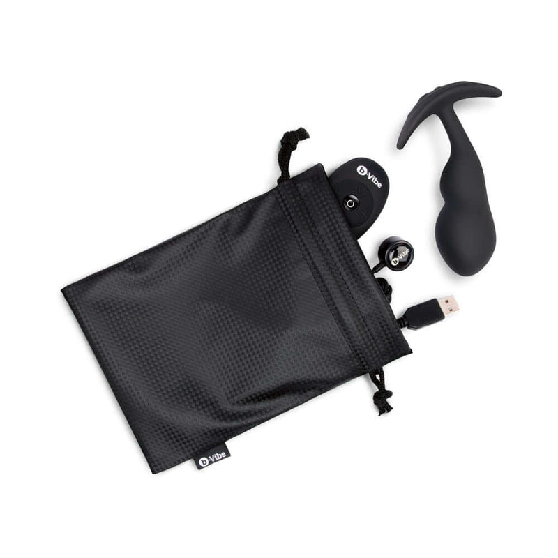 b-Vibe Vibrating P-Spot Snug Plug Large with Remote Control in storage pouch with charging cable.
