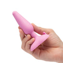 b-Vibe Beginners Vibrating Butt Plug held in a hand, showcasing its sleek pink design and user-friendly shape.