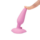 b-Vibe Beginners Vibrating Butt Plug with a finger pressing on its sleek surface