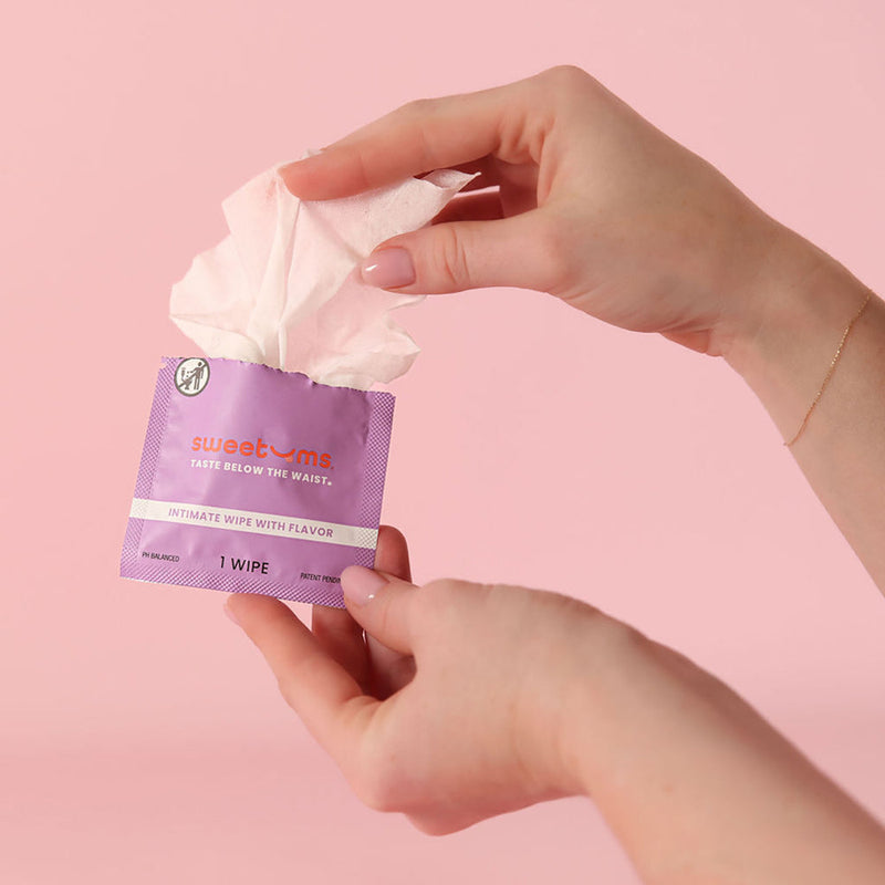 Sweetums Intimate Wipes Honey Lavender Flavor 10 Pack in hand, ready to use for refreshing intimacy.